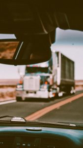 in-cab truck driver sees incoming truck in other lane