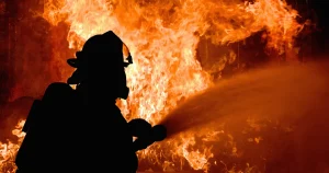 Firefighter putting out fire